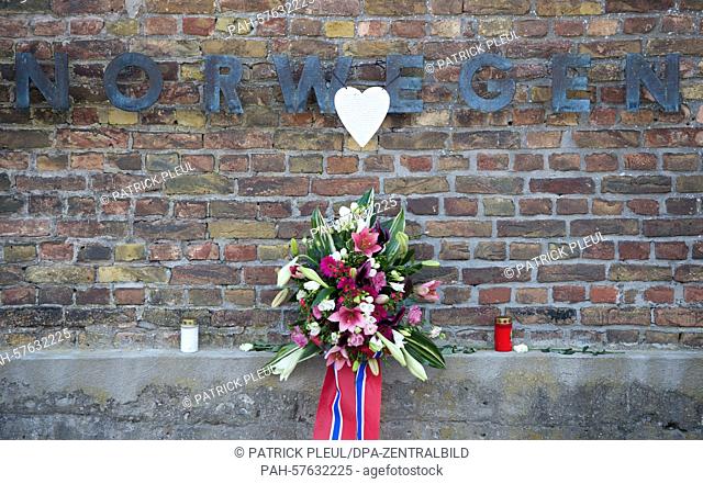 The inscription Norway on the 'Wall of Nations' is decorated with flowers during a memorial ceremony on the 70th anniversary of the liberation of former...
