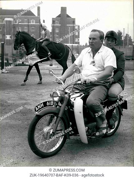 Jul. 07, 1964 - Pat arrives for the Horse Show - by Motor Cycle: Popular horse jumper and car driver Pat Moss arrived at the White City Stadium this morning for...
