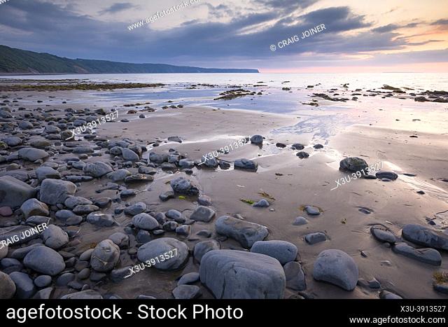 Peppercombe beach at low tide on the North Devon coast with Hartland point in the distance, England