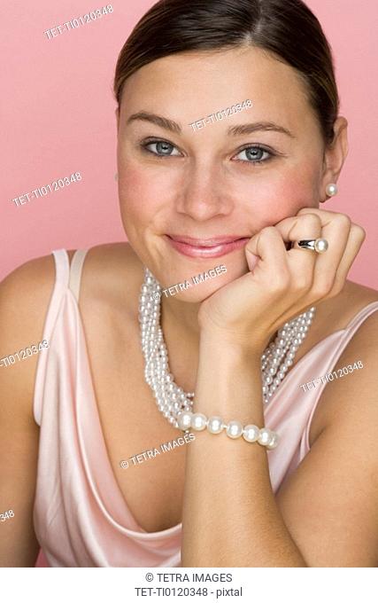 Studio shot of woman wearing pearls