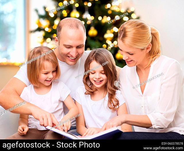 happy family reading book at home on christmas