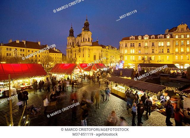 Old Town Square during Christmas time with St Nicholas church in background, Prague, Czech Republic