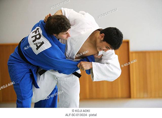 Two Men Competing in a Judo Match