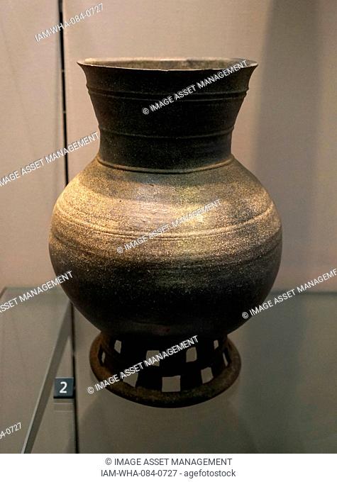Stoneware jar on a perforated pedestal. Dated 5th Century
