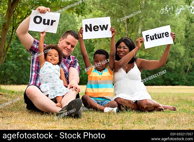 African multicultural family is holding white boards