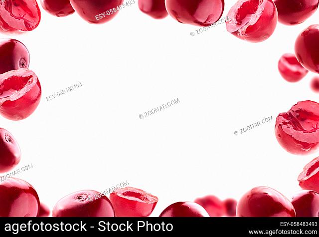 Lots of cherry in the shape of a frame. Isolated on a white background