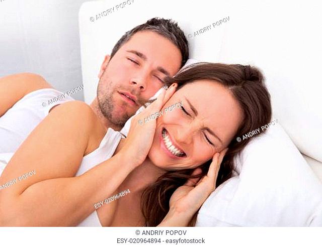 Woman Disturbed With Man Snoring