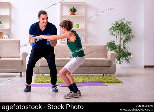 Father and son doing sport exercises at home