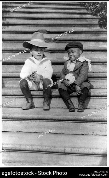 Quentin Roosevelt and Roswell Newcomb Pinckney seated on steps, c1902 June 17. Creator: Frances Benjamin Johnston