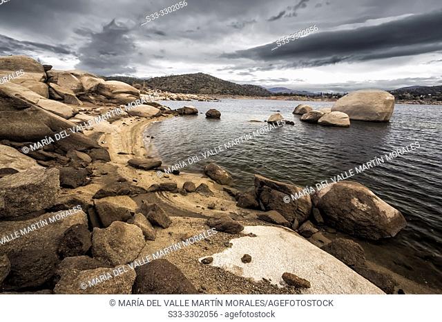 Burguillo reservoir in Iruelas Valley early in the morning on a cloudy day. Avila. Spain. Europe
