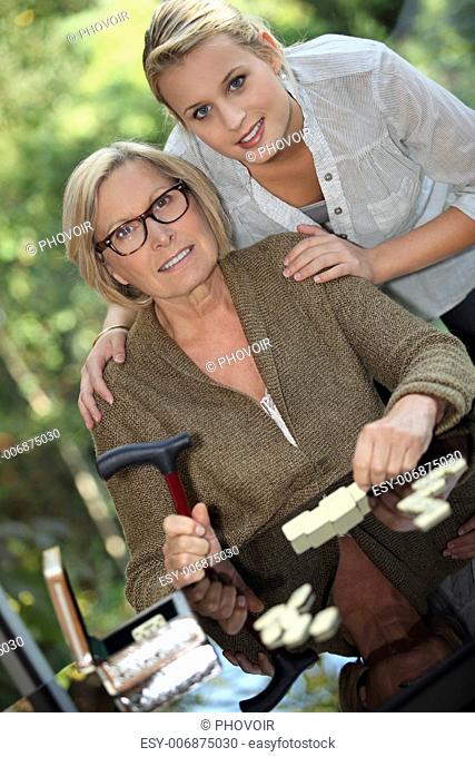 Young woman posing with her grandmother