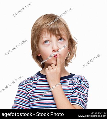 Boy Looking Thinking, Finger on his Mouth - Isolated on White