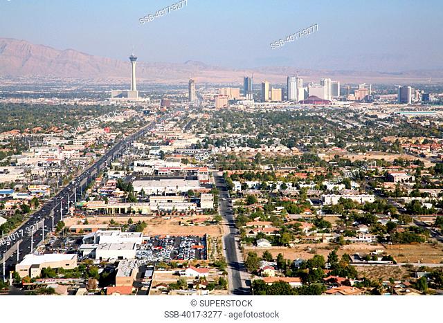 Aerial view of the Las Vegas Strip skyline with residential areas in foreground and mountains in background, Las Vegas, Clark County, Nevada, USA