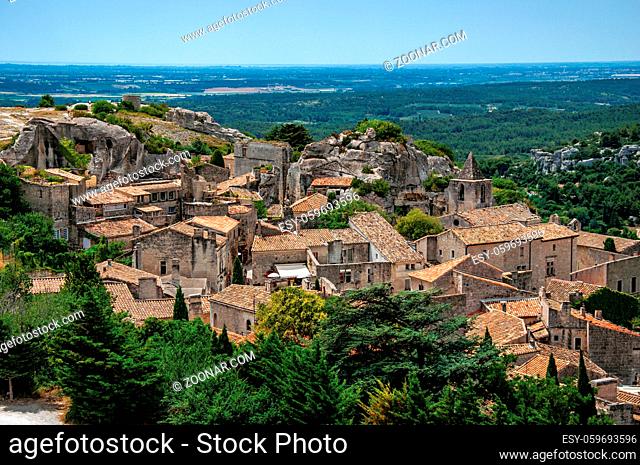 View of the roofs and houses of the village of Baux-de-Provence, with the hills of Provence just below. Bouches-du-Rhone department