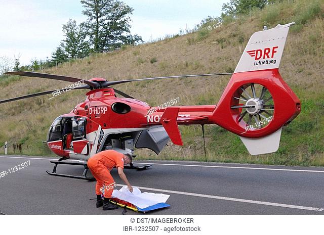 Rescue helicopter at a serious motorcycle accident on the Bundesstrasse B 295 highway between Leonberg and Renningen, Baden-Wuerttemberg, Germany, Europe