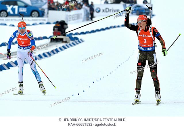 Laura Dahlmeier (R) from Germany celebrates after crossing the finish line in front Kaisa Makarainen from Finland during the Women 12