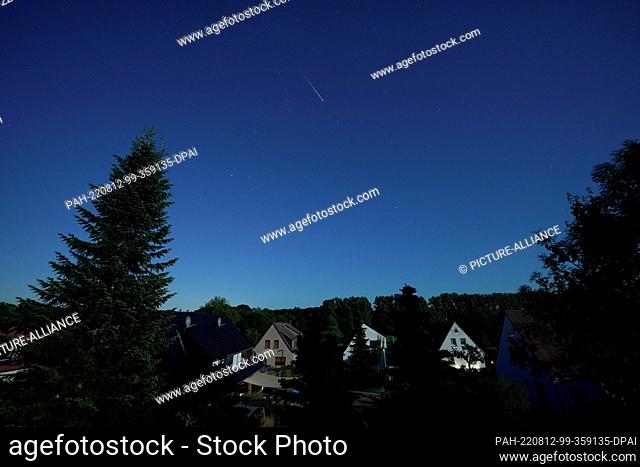 12 August 2022, Lower Saxony, Harpstedt: A shooting star burns up in the night sky. Saturday morning is expected to be the peak of the Perseid shooting stars