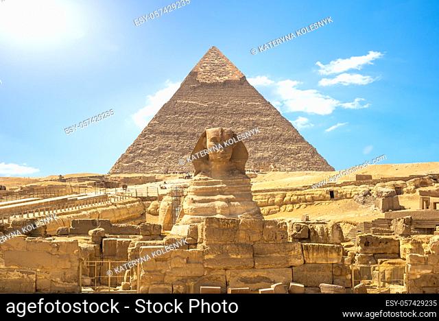 Front view of Sphinx and Khafre pyramid in the desert of Giza, Egypt