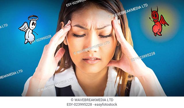 Nervous businesswoman holding her head against blue background