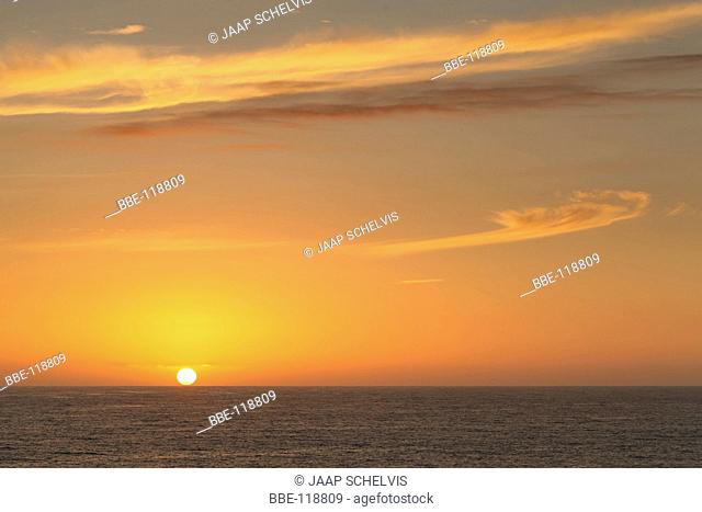 Setting sun just above the horizon of the Atlantic Ocean