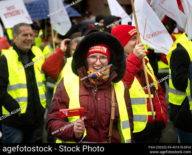 02 February 2023, North Rhine-Westphalia, Dortmund: During a one-day warning strike, Coca-Cola employees lend weight to their demands with a demonstration march