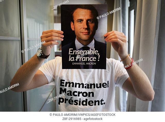 Emmanuel Macronâ. . s supporter Gael Bruyns , 19 years old poses for the pictures with a poster of President of the political movement 'En Marche !' (Onwards