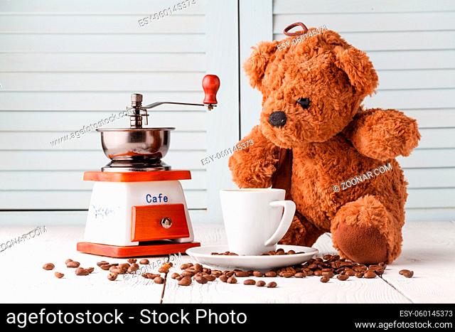 Teddy bear with cup of coffee