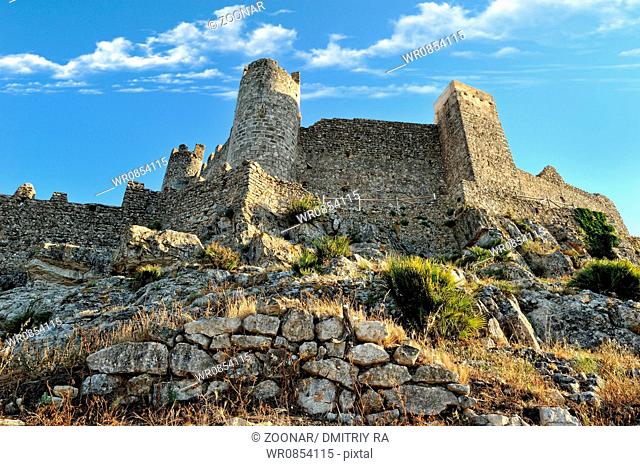 Bottom view to the old castle and mountains. Alcala de Xivert in Spain