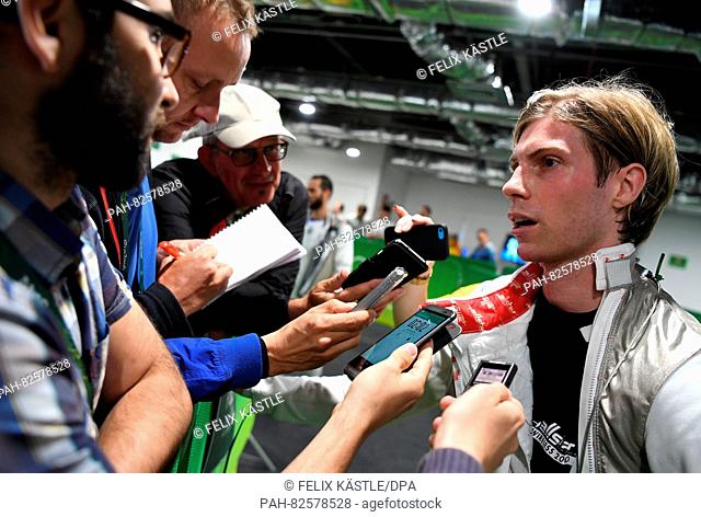 Peter Joppich of Germany is interviewed by journalists after loosing against Giorgio Avola of Italy during the men's Foil individual round of 16 event of the...