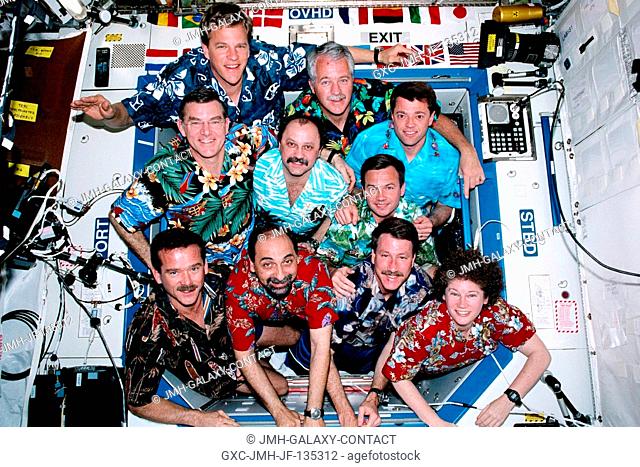 STS-100 and Expedition Two crew members pose for traditional in-flight portrait in Destiny laboratory. Bottom, from left, Chris A