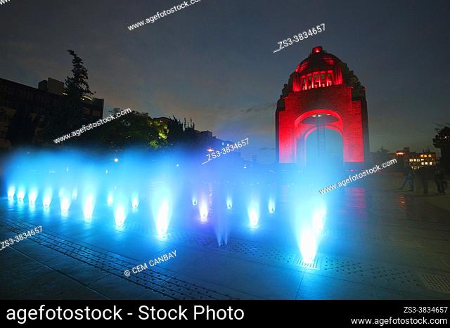 Silhouettes of people in front of the Monument dedicated to the Mexican Revolution-Monumento dedicado a la Revolucion Mexicana by night, Mexico City, Mexico
