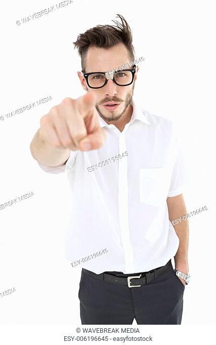 Nerdy businessman pointing at camera