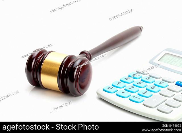 Wooden judge's gavel and calculator