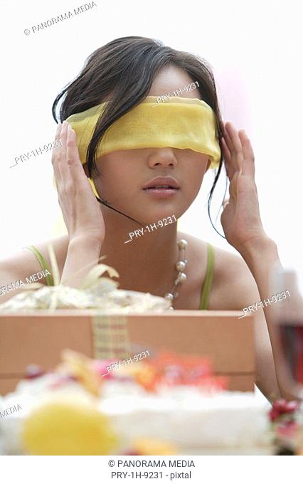 Blindfolded woman with gift