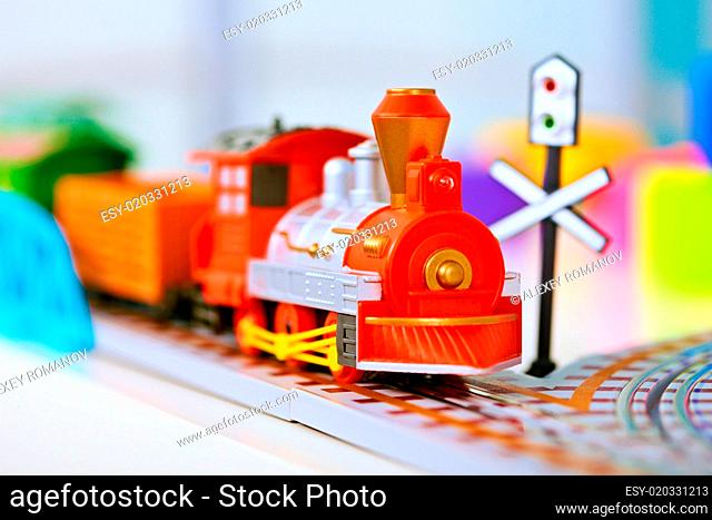 Toy miniature locomotive on railroad