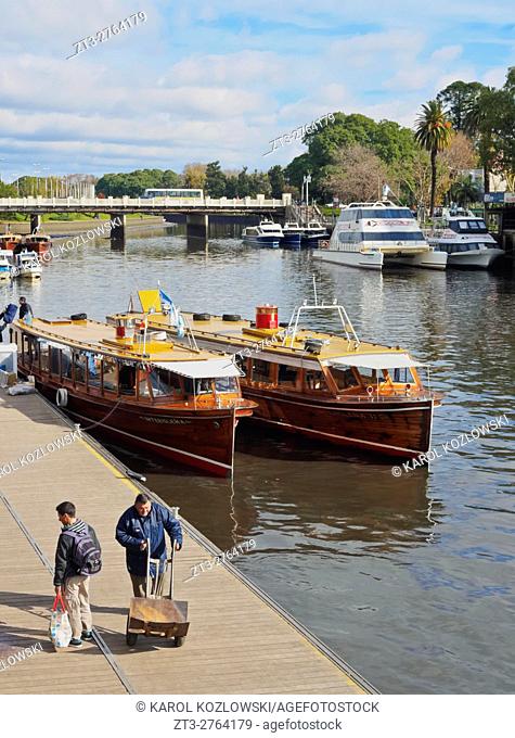 Argentina, Buenos Aires Province, Tigre, Vintage mahogany motorboats by the Fluvial Station on the Tigre River Canal