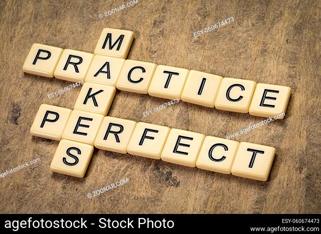 practice makes perfect crossword in ivory letters against textured bark paper, education and training concept