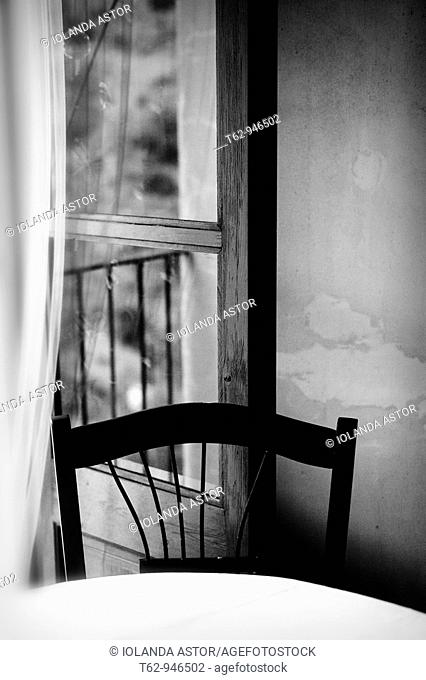 A chair in a cozy corner room  Light and shadow