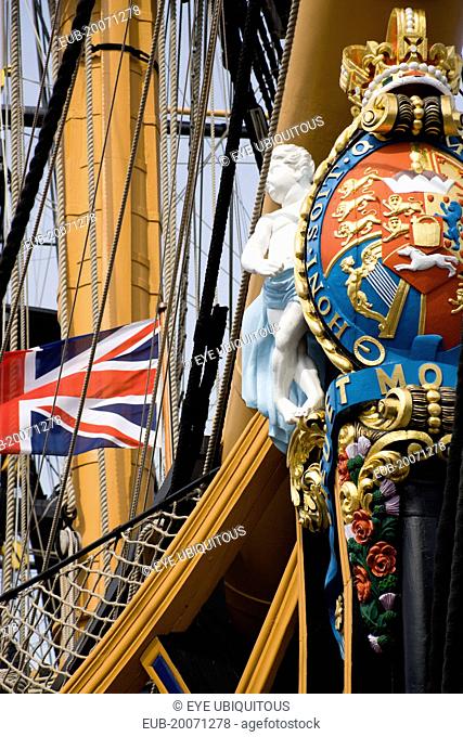 Bow and rigging of Admiral Lord Nelsons flagship HMS Victory showing the ships figurehead with Royal Crest and Union Flag in the Historic Naval Dockyard