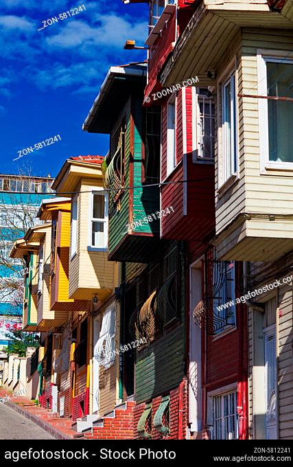 Colorful street scene with very narrow house painted. Historic houses in Istanbul, Fatich