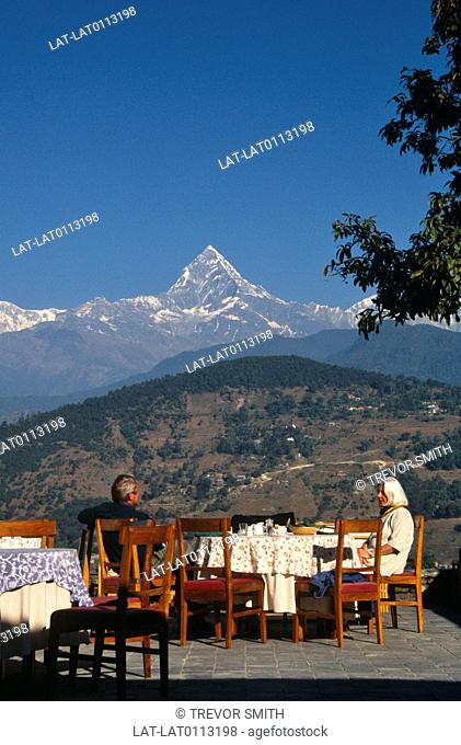 In the Annapurna range, the Machapuchare or Fishtail triangular peak dominates the city of Pokhara and the surrounding valley