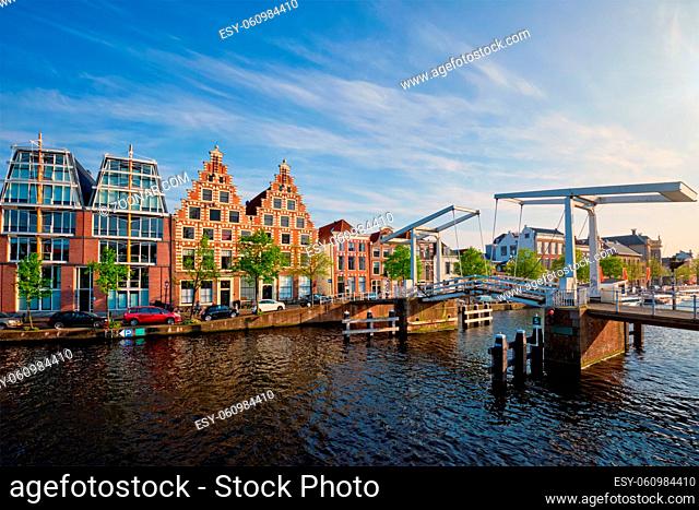 Gravestenenbrug bridge on Spaarne river and old houses in Haarlem, Netherlands