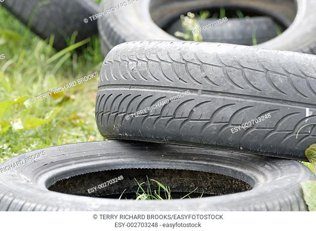Used, dumped car tyres  Copy space