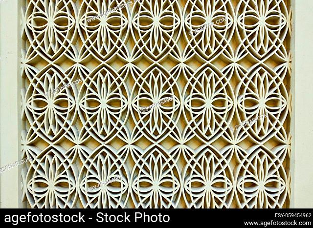 Wall with figured arabian pattern. Architectural detail close-up