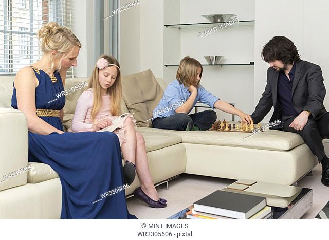 Caucasian family relaxing in living room