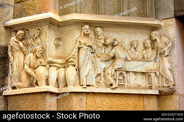 Ancient bas-reliefs on the Windows and walls of historical buildings. Architectural design elements from the past. The biblical parable of the feast in Cana of...