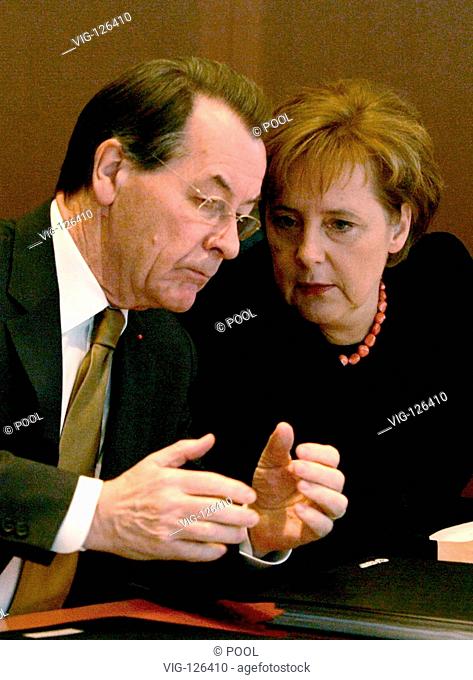 German Chancellor Angela Merkel (R) talks to Vice-Chancellor and Labour Minister Franz Muentefering (L) prior to the weekly cabinet meeting at the Chancellery