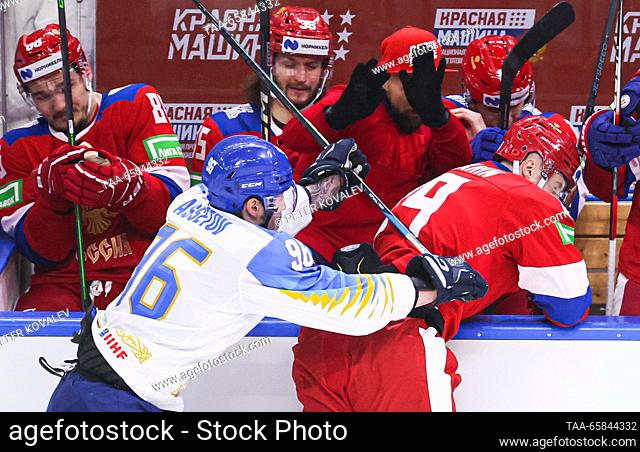 RUSSIA, ST PETERSBURG - DECEMBER 17, 2023: Kazakhstan's Alikhan Asetov (L) and Russia 25's Ilya Karpukhin in action in their 2023 Channel One Cup ice hockey...
