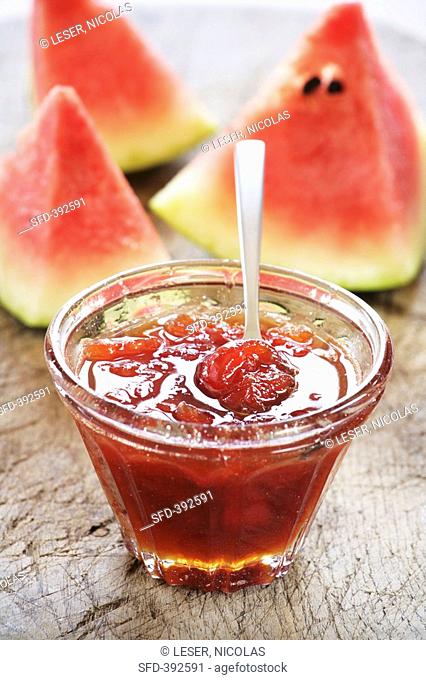 Watermelon jam in glass dish with spoon