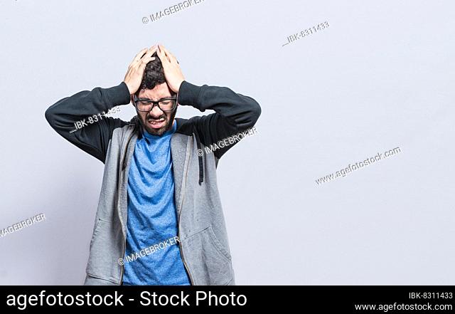 People rubbing his head on isolated background, Concept of a person with a headache, guy giving himself a head massage, concept of a man with a migraine